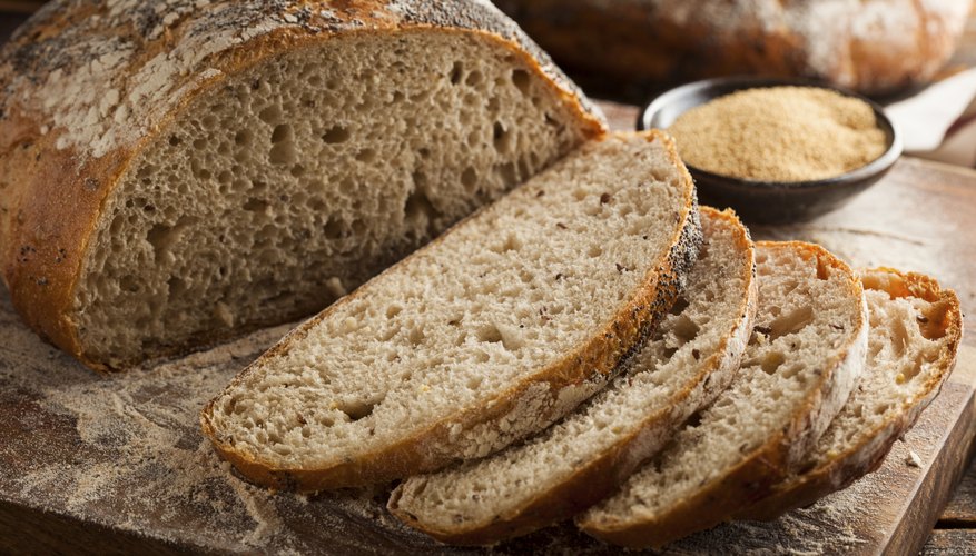 A sliced loaf of whole wheat bread. A sliced loaf of whole wheat bread.
