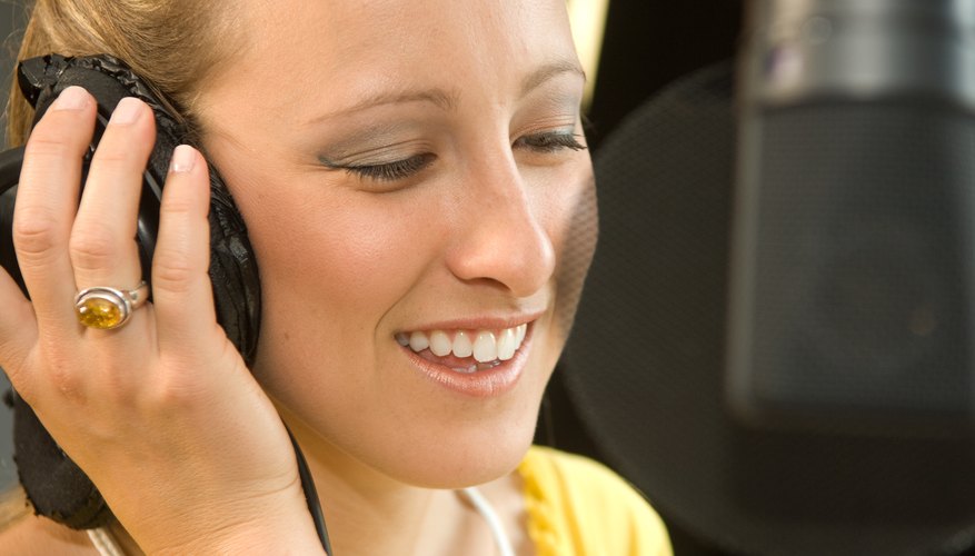 Photo Credit: Jupiterimages/Photos.com/Getty Images Teenager in a recording studio