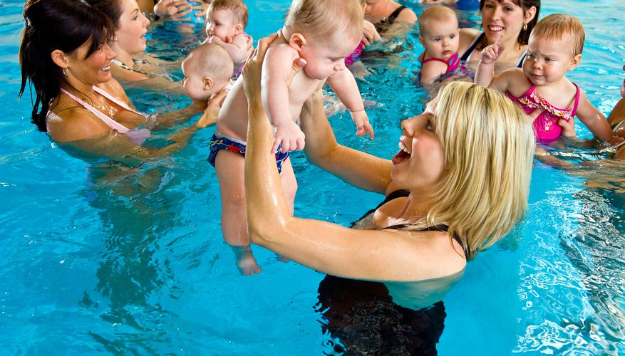Swim diapers are water repellent and fit snugly around your child's waist, explains Mayo Clinic. Swim diapers are water repellent and fit snugly around your child's waist, explains Mayo Clinic.