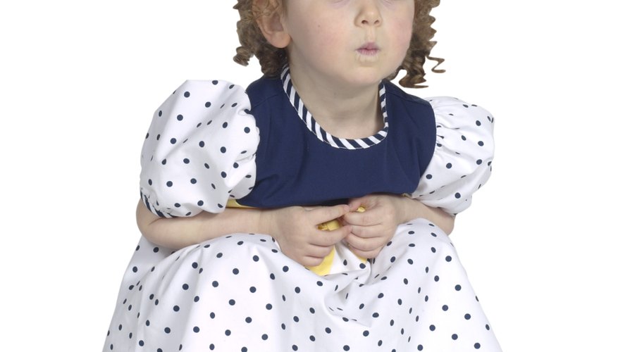 Decorate a little girl's dress with a large bow. Decorate a little girl's dress with a large bow.