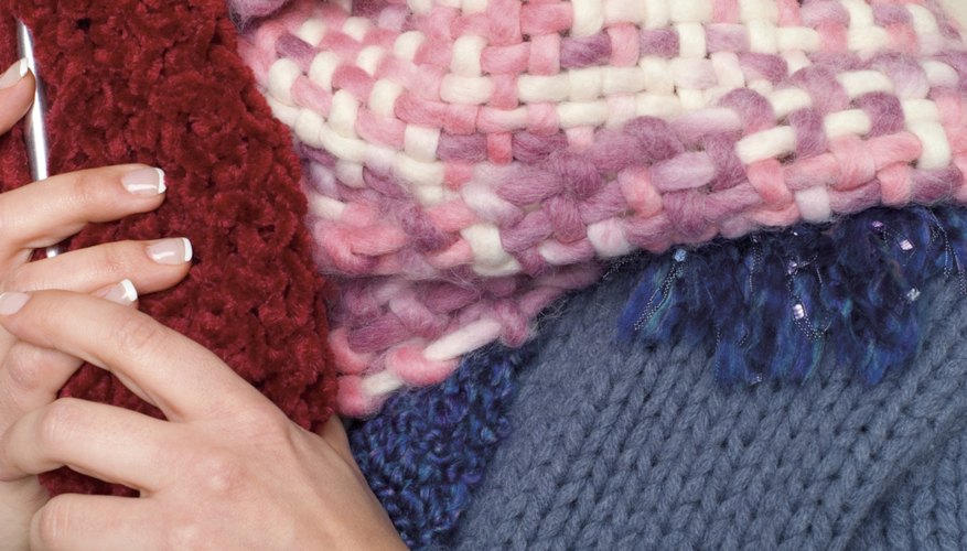 Use a Knifty Knitter to create a handmade scarf. Use a Knifty Knitter to create a handmade scarf.