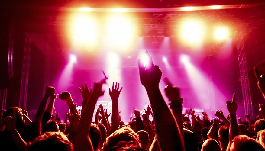 Music fans listening to a live concert Music fans listening to a live concert