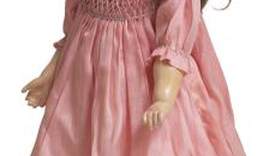 Re-stringing antique dolls gives them new life. Re-stringing antique dolls gives them new life.