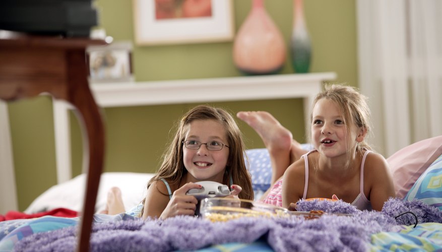Girls watching movie in bed Girls watching movie in bed