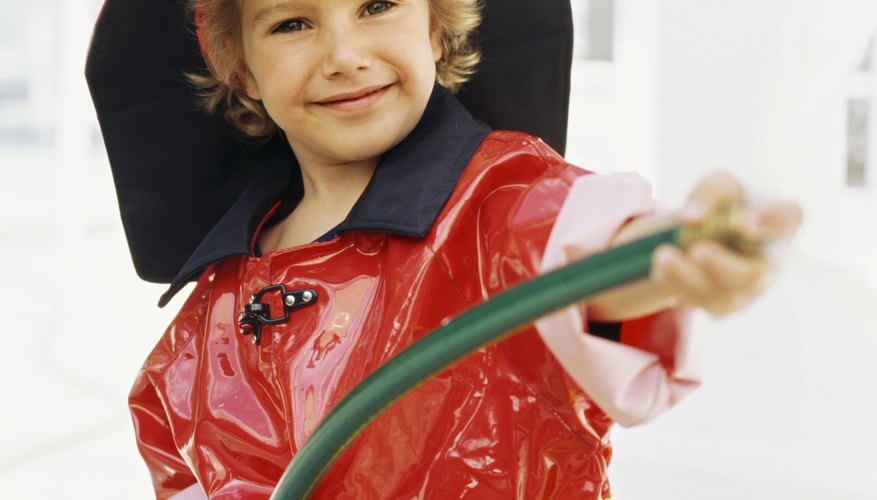Dress-up costumes let your child play the role of firefighter. Dress-up costumes let your child play the role of firefighter.