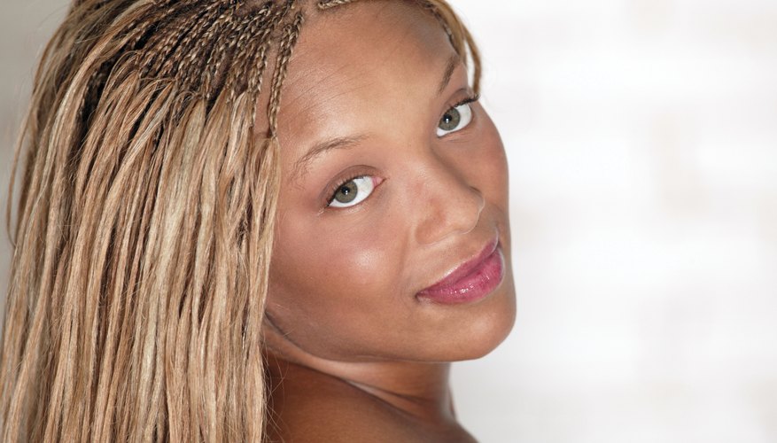 Hair extensions, weaves and silk closures help women achieve a natural look with synthetic hair. Hair extensions, weaves and silk closures help women achieve a natural look with synthetic hair.