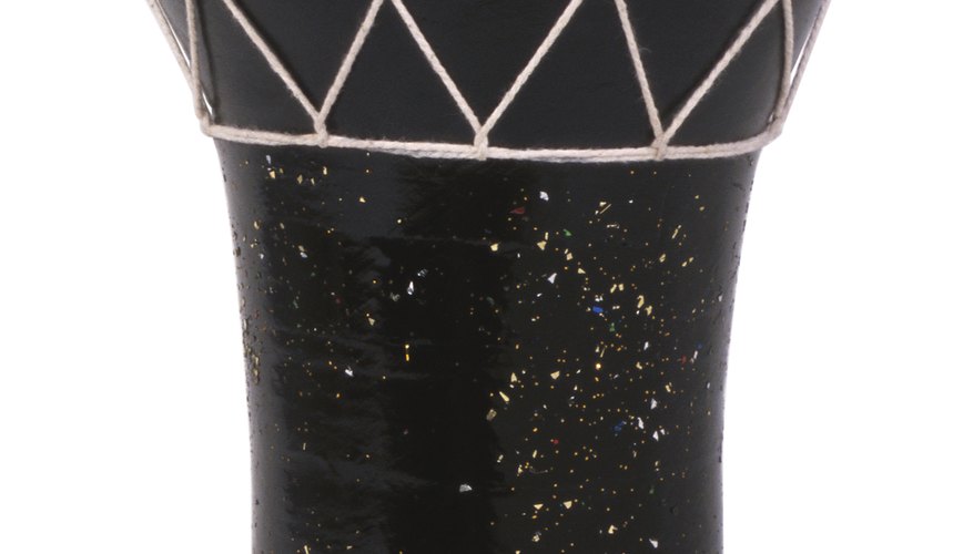 The goblet-shaped djembe drum features a goat skin playing surface. The goblet-shaped djembe drum features a goat skin playing surface.