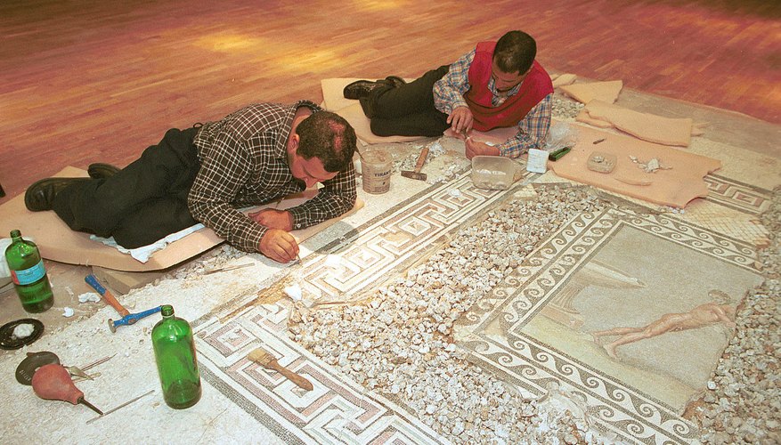 Photo Credit: Norbert Schiller/Getty Images News/Getty Images Archeologists restore Greco-Roman mosaic inside the Bibliotheca Alexandrina in Egypt