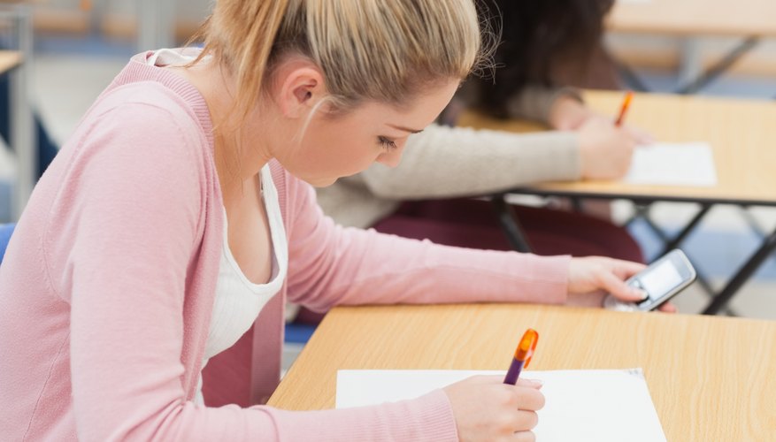 A student cheating on a test. A student cheating on a test.