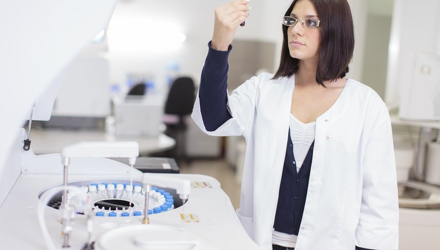 A lab technician is analyzing a blood sample. A lab technician is analyzing a blood sample.