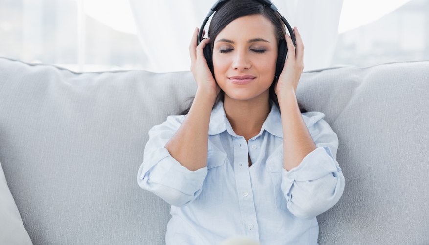 A lady is listening to music. A lady is listening to music.