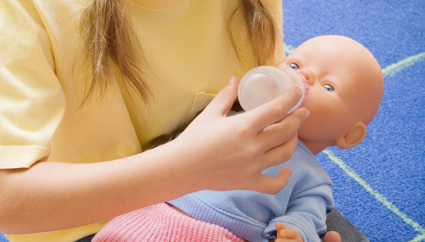 Parents often encourage little girls to play with Parents often encourage little girls to play with