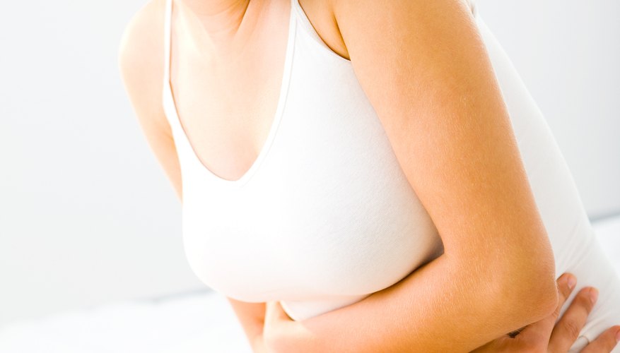 Woman holding stomach Woman holding stomach