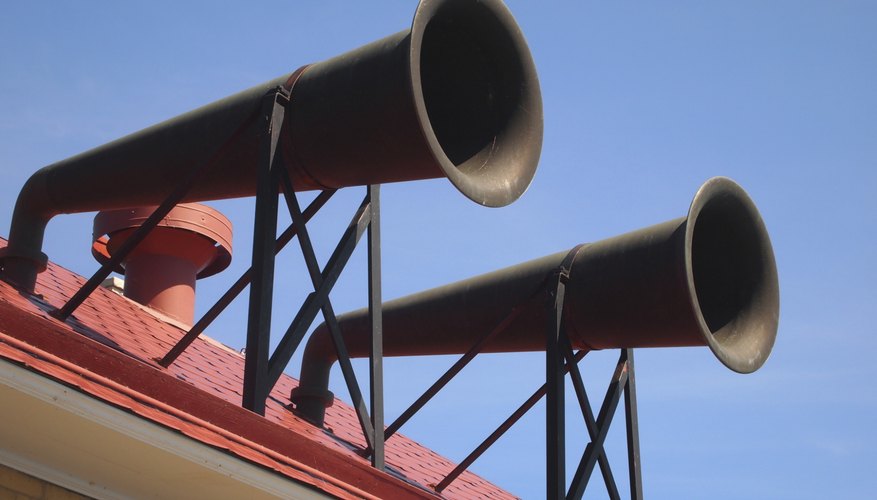 A pair of fog horns on a rooftop. A pair of fog horns on a rooftop.