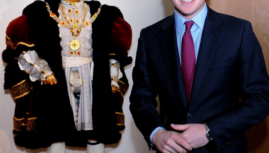 Prince Harry of Wales with a Henry VIII doll. Prince Harry of Wales with a Henry VIII doll.
