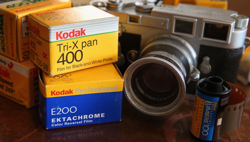 Vintage Leica camera next to kodak film Vintage Leica camera next to kodak film