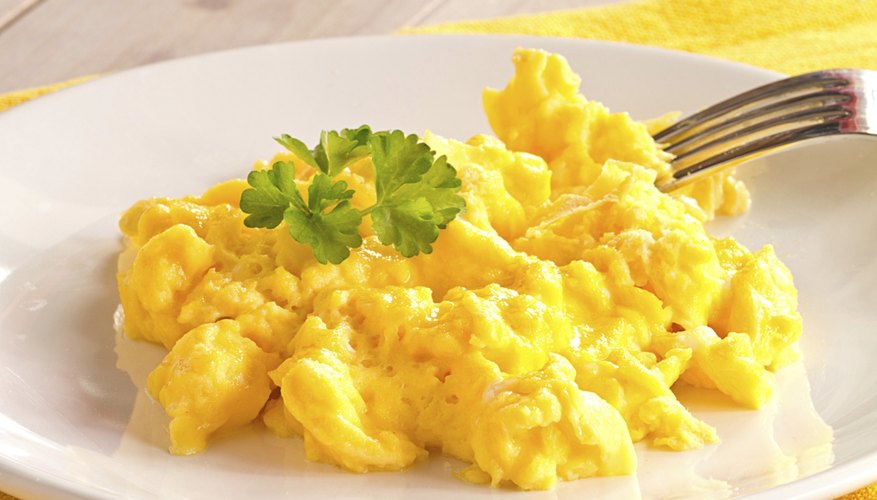 A plate of scrambled eggs. A plate of scrambled eggs.