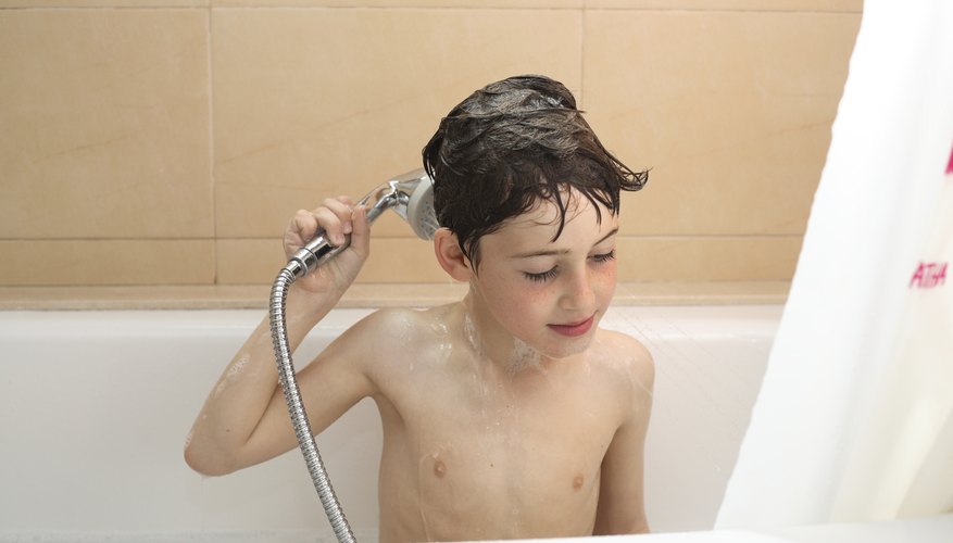 Invest in a handheld shower head so your child feels more control over the spray. Invest in a handheld shower head so your child feels more control over the spray.