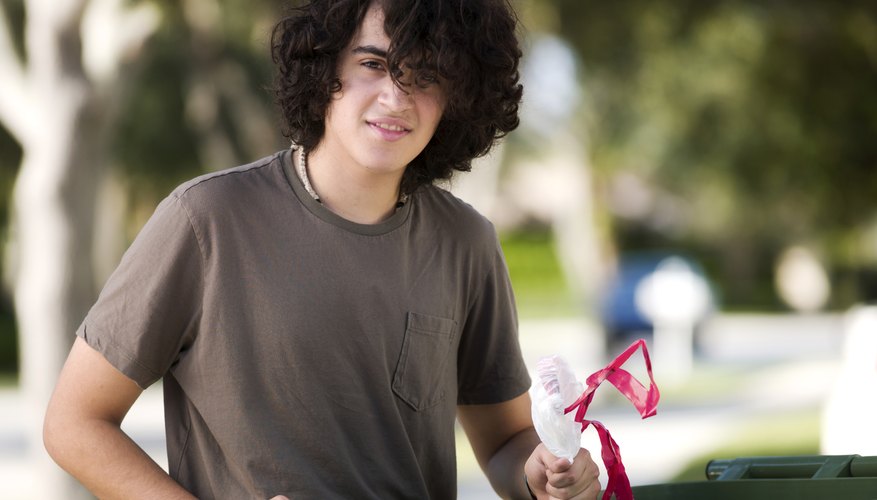 Teenager taking out garbage. Teenager taking out garbage.