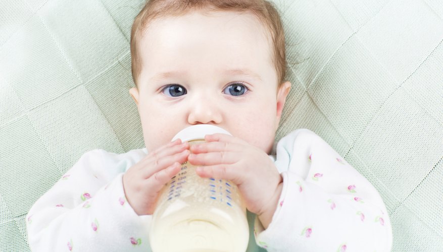 Baby drinking formula from bottle Baby drinking formula from bottle