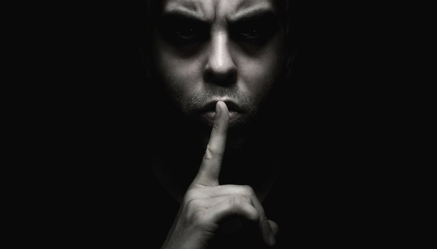 Photo Credit: Nastco/iStock/Getty Images Evil man gesturing for silence