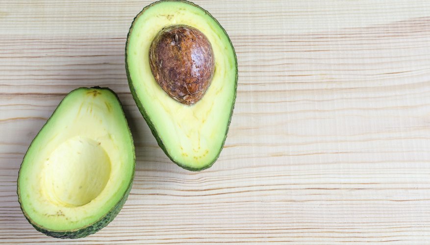 A halved avocado. A halved avocado.