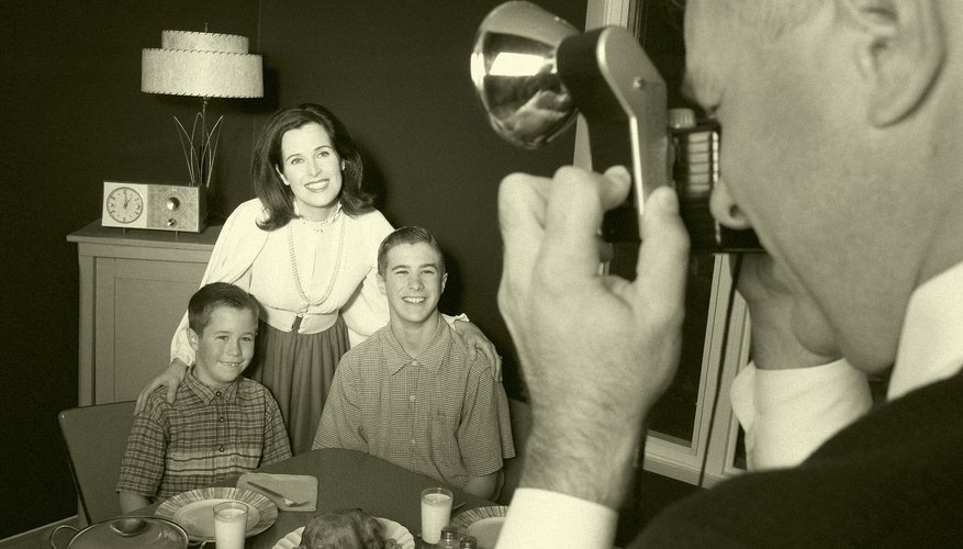 Vintage photograph of man taking photo of family Vintage photograph of man taking photo of family