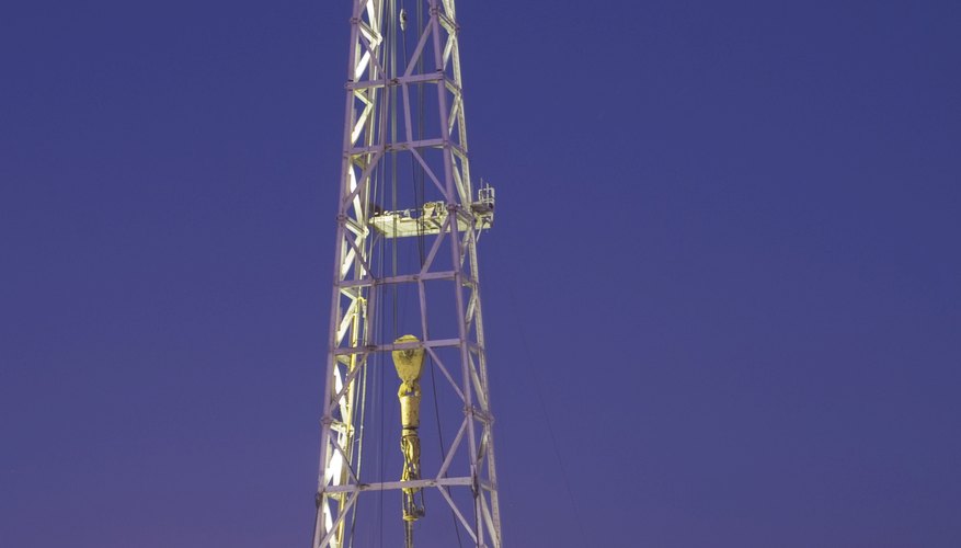 A drilling rig is used to search for underground oil reservoirs. A drilling rig is used to search for underground oil reservoirs.
