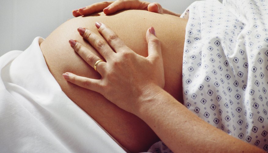 Painless abdominal tightening is normal in most cases. Painless abdominal tightening is normal in most cases.