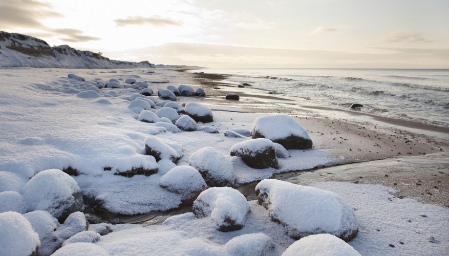 Snow and ice on rocks along the beach. Snow and ice on rocks along the beach.