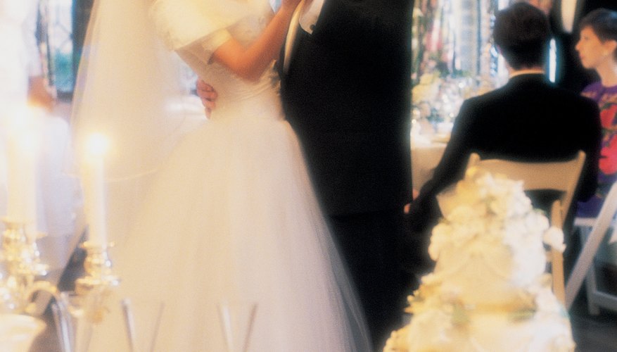 Drape the lights and tulle on one specific table, or decorate each table with them. Drape the lights and tulle on one specific table, or decorate each table with them.