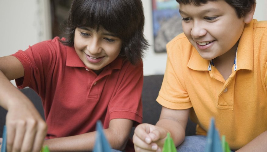 Boys playing a board game Boys playing a board game