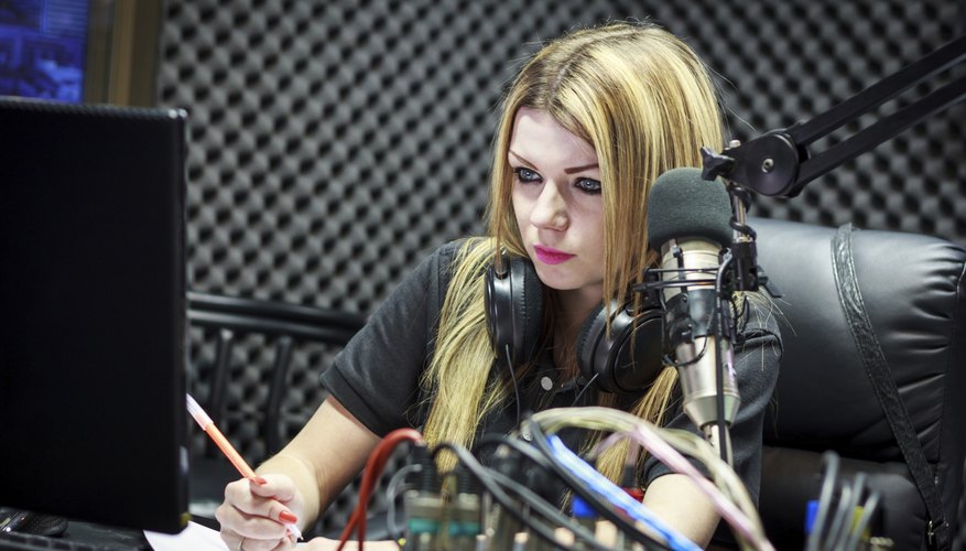 Radio DJ in front of a microphone Radio DJ in front of a microphone