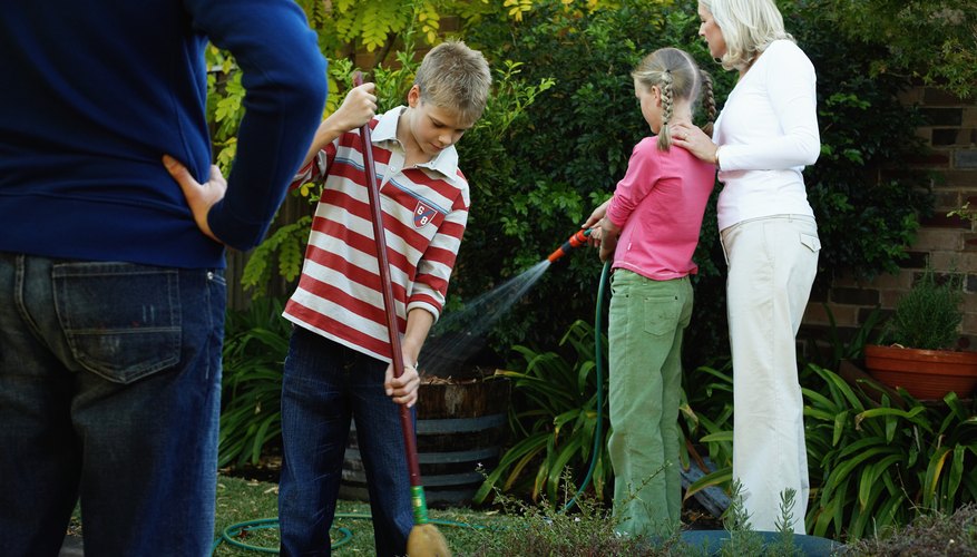 Young teenagers helping in the garden. Young teenagers helping in the garden.