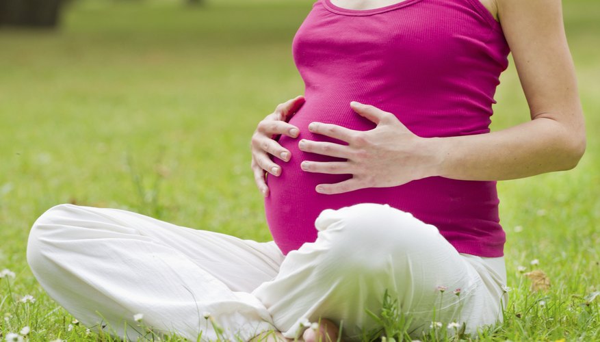 pregnant woman on grass pregnant woman on grass