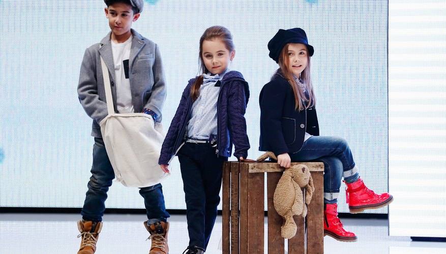 Three young fashion models on a runway. Three young fashion models on a runway.