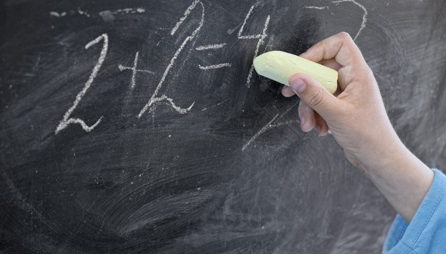 Numbers being added on chalkboard Numbers being added on chalkboard