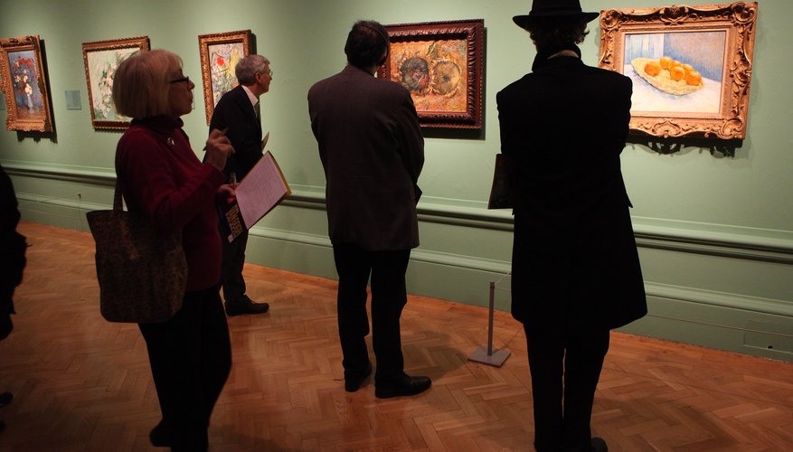 People viewing artwork done by Dutch master Vincent Van Gogh People viewing artwork done by Dutch master Vincent Van Gogh