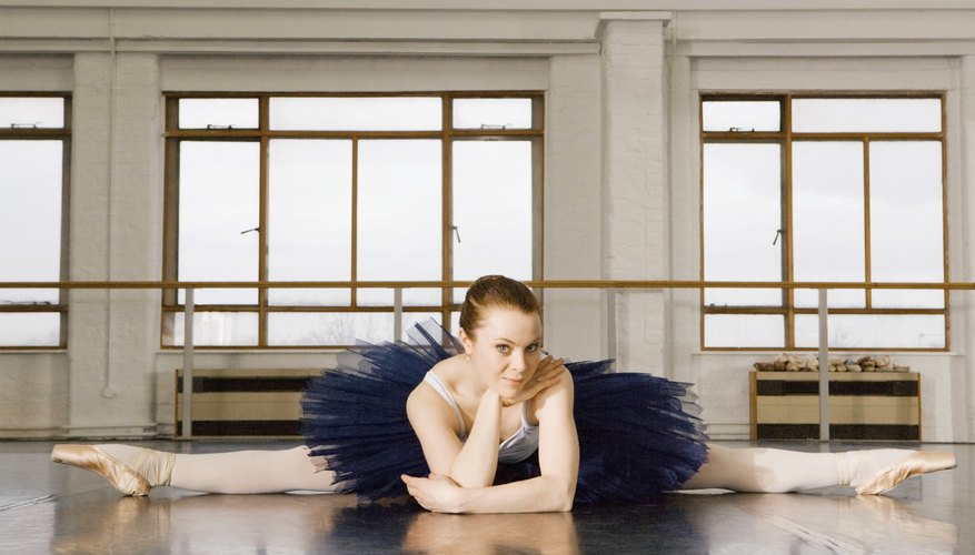 Photo Credit: Jupiterimages/Pixland/Getty Images Practice the splits.
