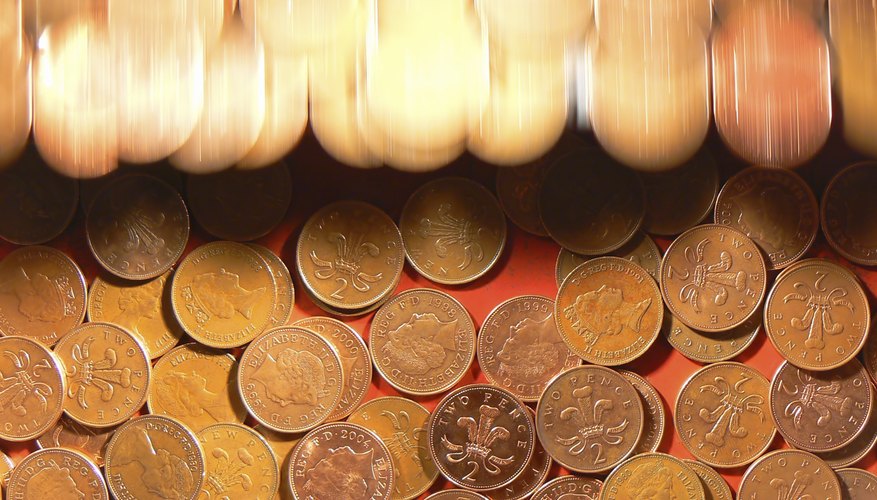 Photo Credit: Yan Shun Ling/iStock/Getty Images Coin pusher game with English currency
