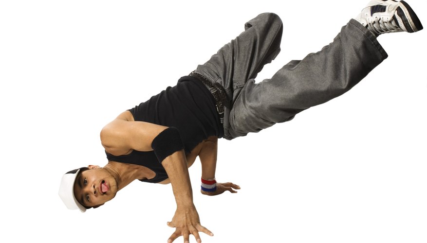 Cardboard dance mats protect dancers from the rough surface of the street. Cardboard dance mats protect dancers from the rough surface of the street.