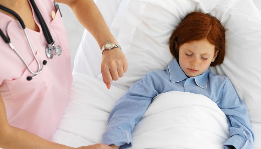 Nurse taking child's pulse Nurse taking child's pulse