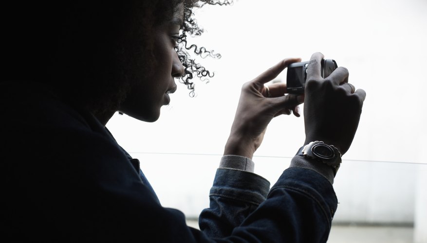Woman taking photo on camera Woman taking photo on camera