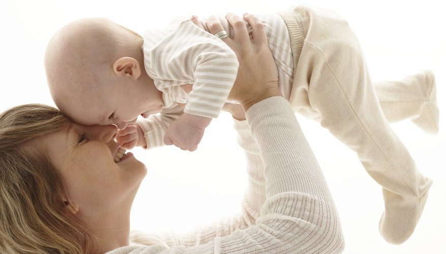 Playing with a parent helps a 3-month old grow and learn. Playing with a parent helps a 3-month old grow and learn.
