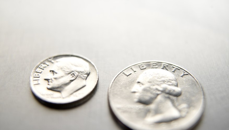 Photo Credit: Paul Tearle/Stockbyte/Getty Images Quarter size compared with a dime.