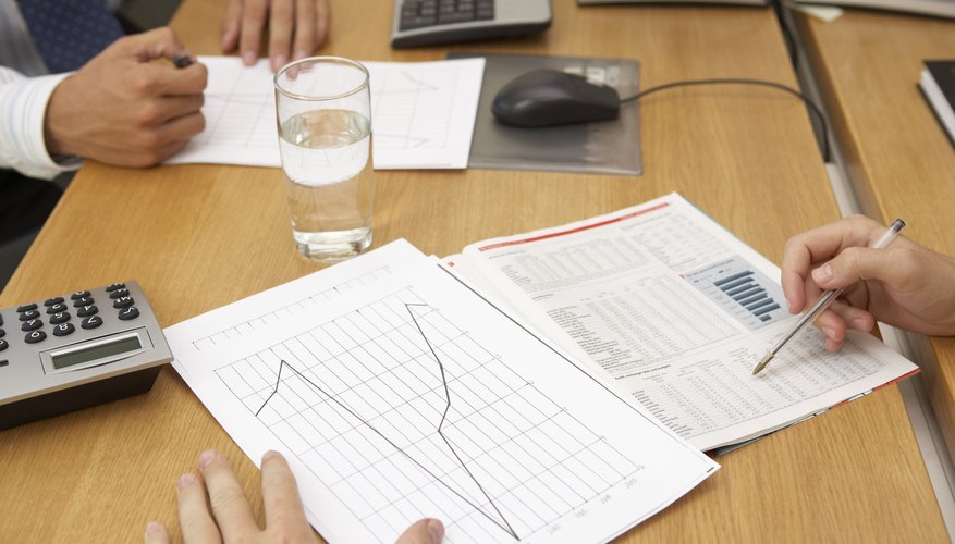 Business team looking at chart Business team looking at chart