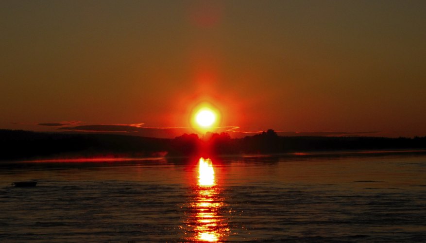 Red, setting sun over the ocean Red, setting sun over the ocean