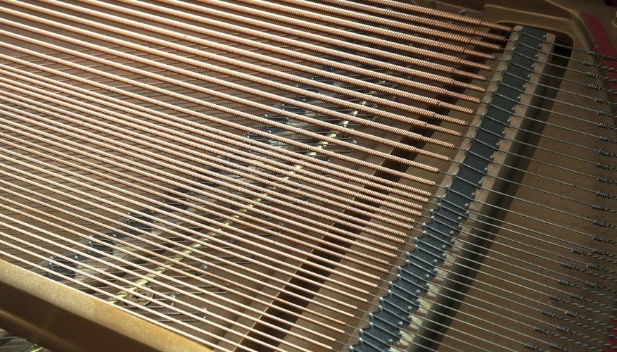 Photo Credit: Pipop_Boosarakumwadi/iStock/Getty Images The strings inside a grand piano.