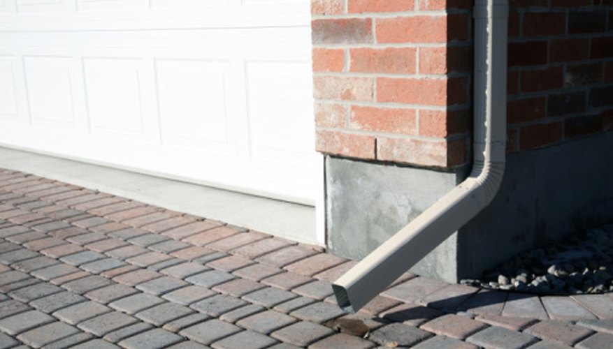 Rain barrels are connected to downspouts. Rain barrels are connected to downspouts.