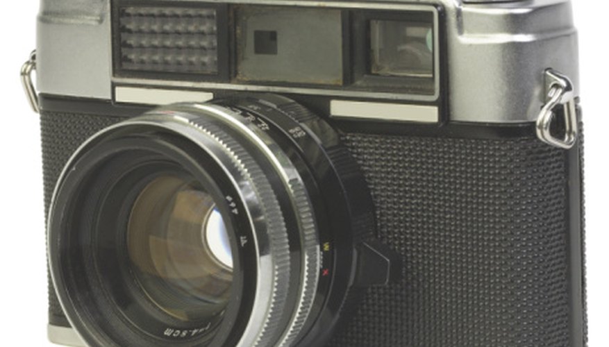 SLR film cameras use a semi-automatic moving mirror system. SLR film cameras use a semi-automatic moving mirror system.